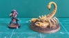Painted Greater Mutant Scorpion miniature alongside a 28mm scale human miniature (2)